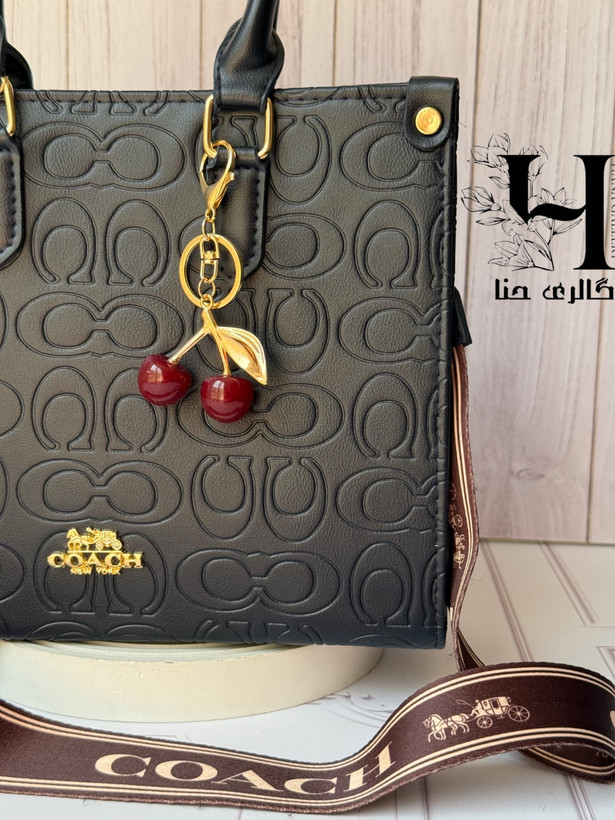 کیف کوچ سرمهای برجسته با آویز آلبالو